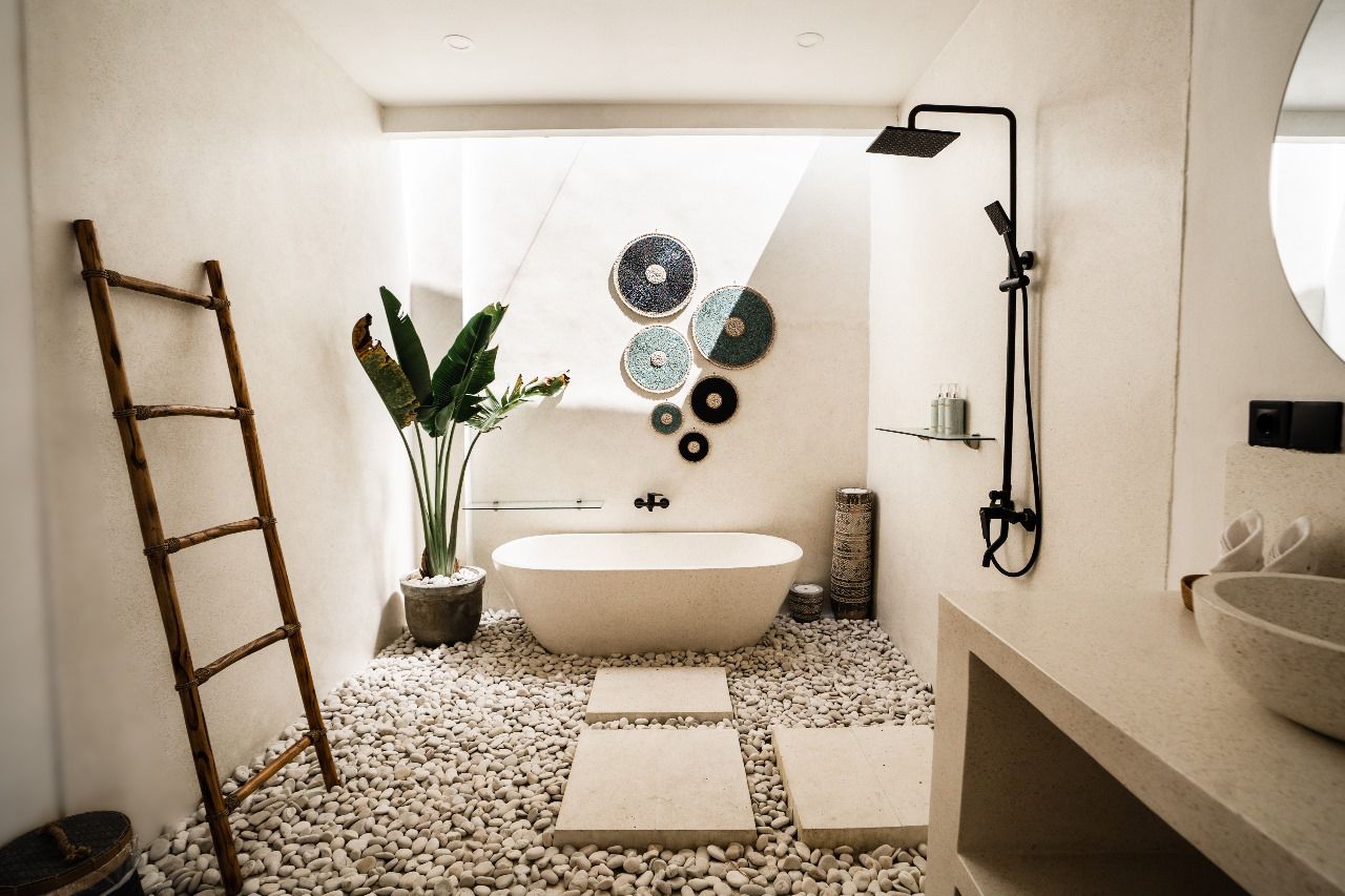 Stone bathroom with freestanding tub at Villa Amazonica