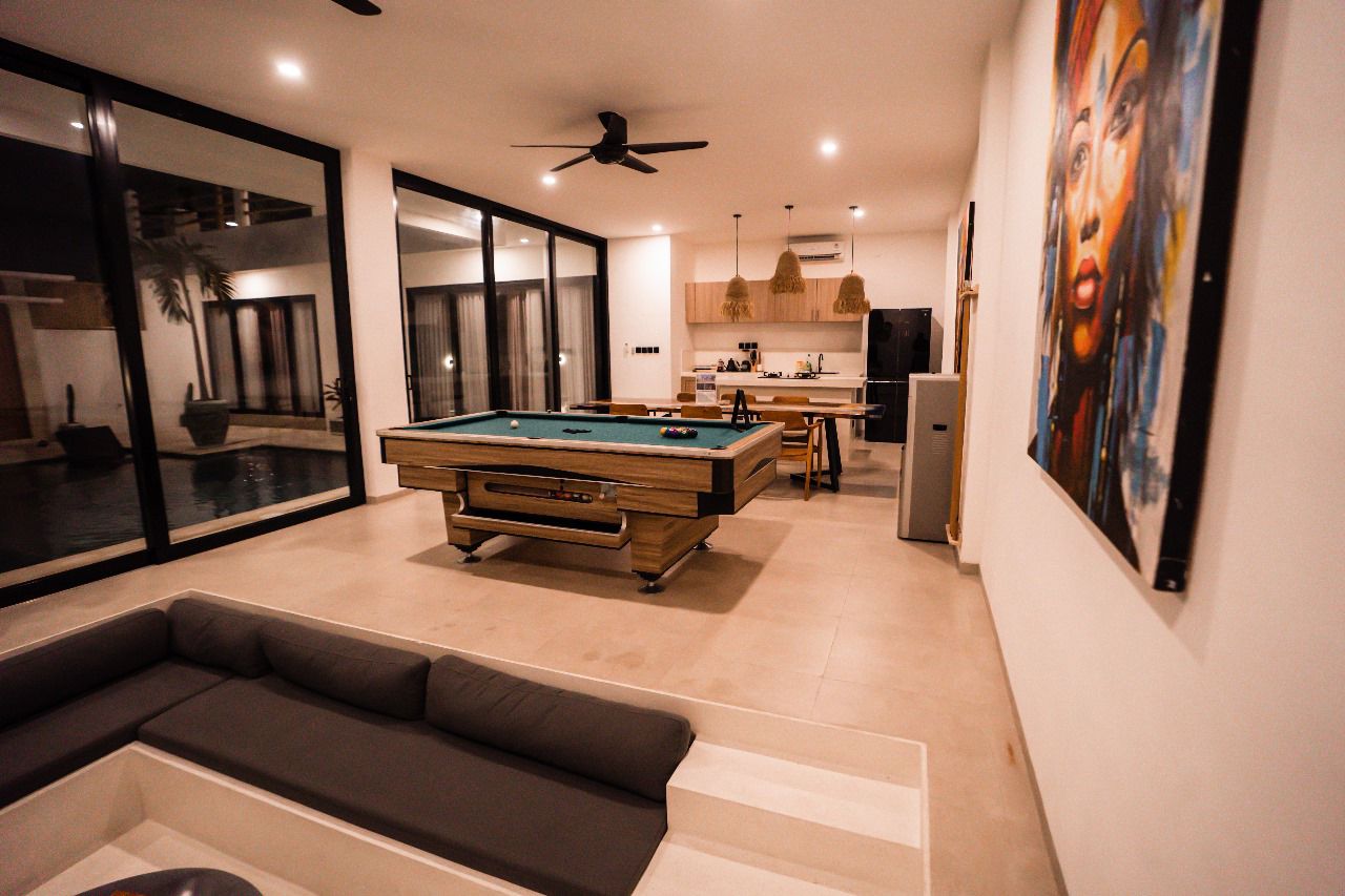 Open-plan living room and games room at Villa Amazonica