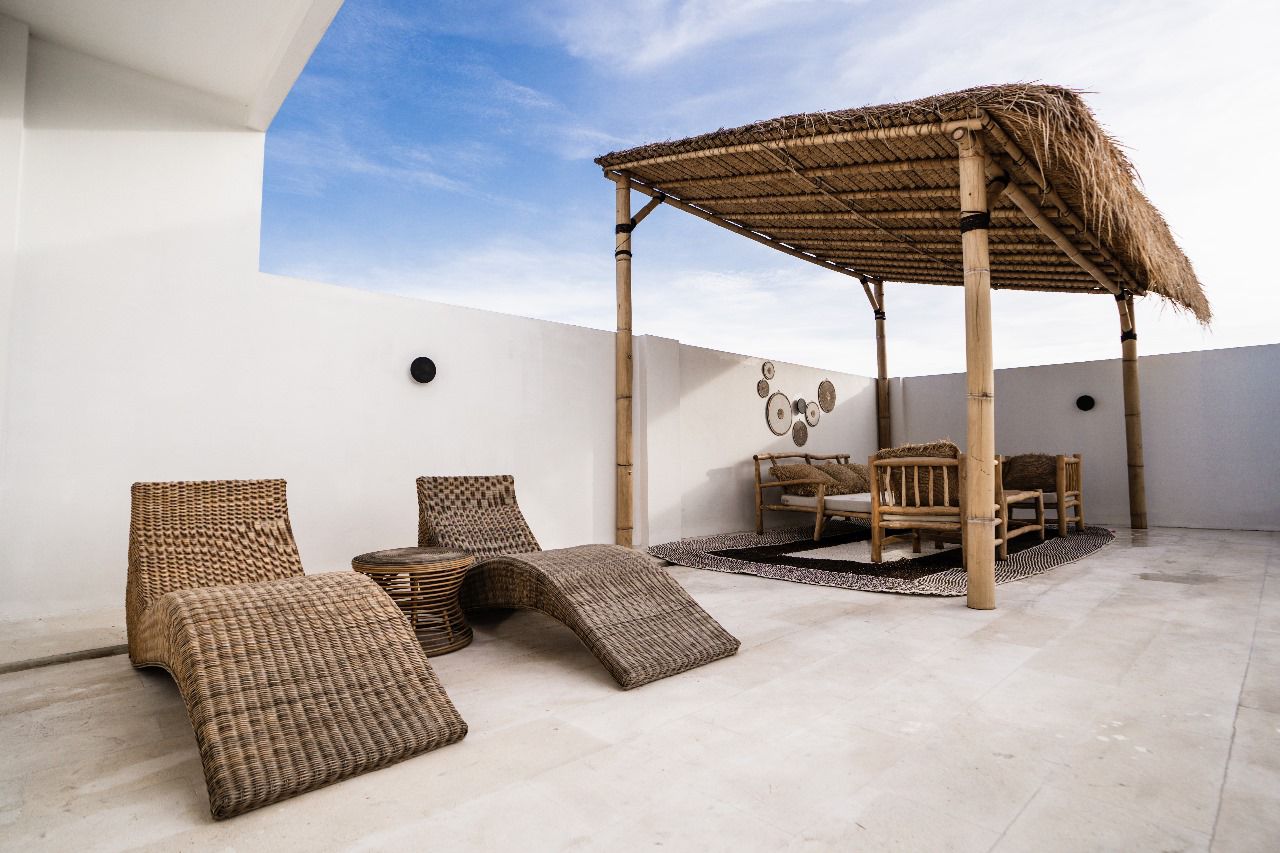 Rooftop bale and rattan loungers at Villa Amazonica